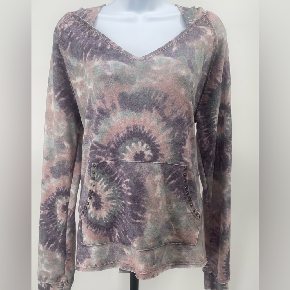 Tie-dye hoodie, featuring unique patterns and subtle studded accents.